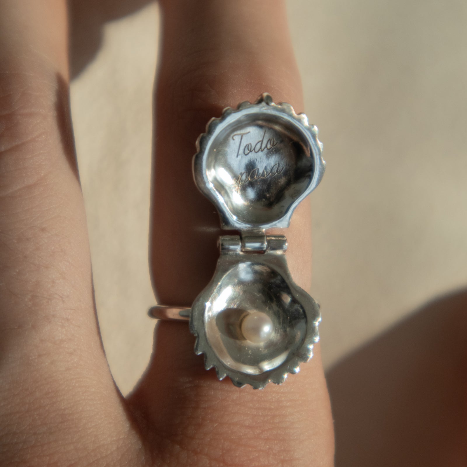 Handmade silver ring with seashell that opens and closes